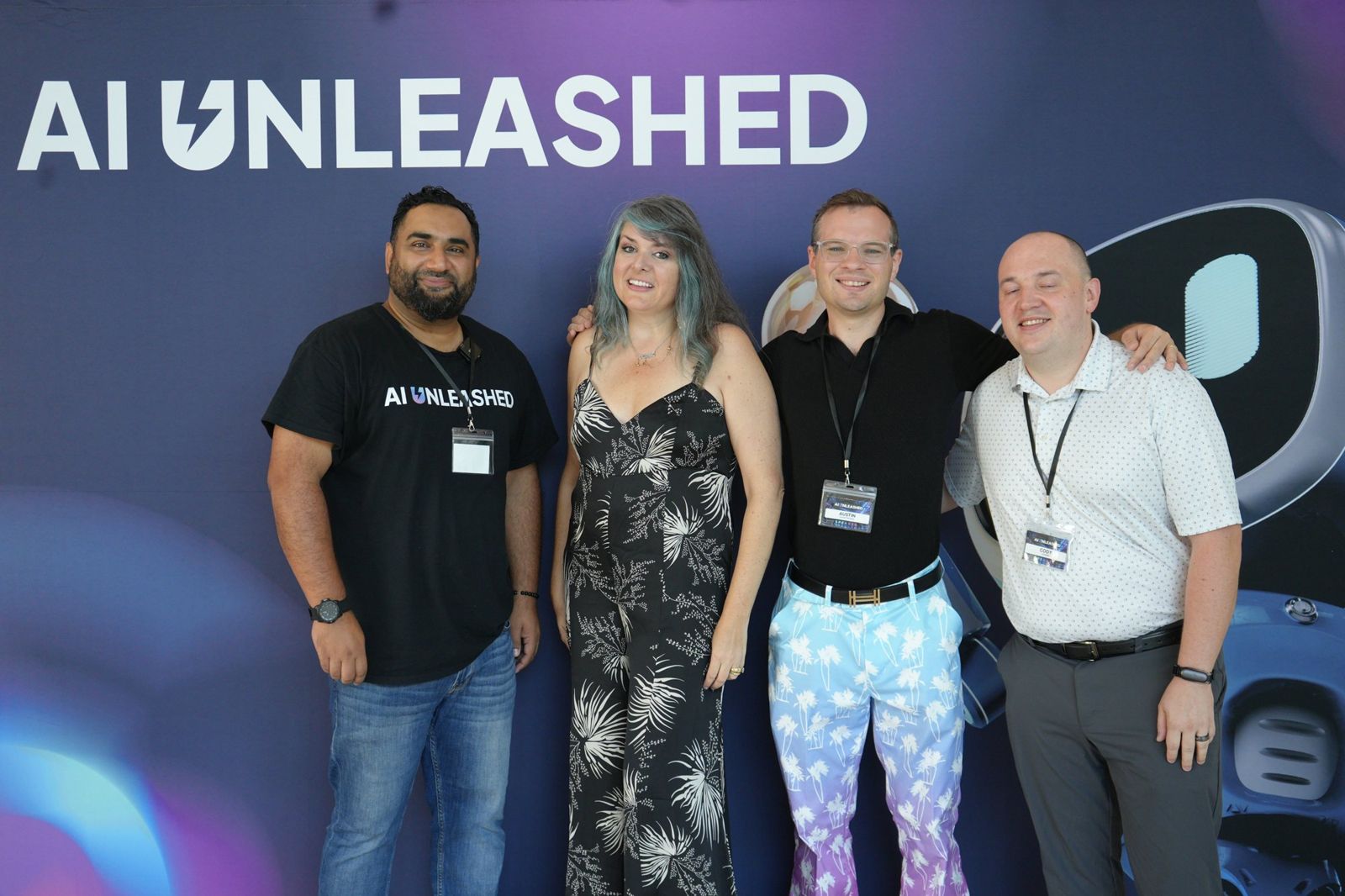 Fer with AI Unleashed attendees at the photo wall
